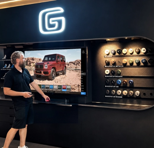 Firehorse Studio founder providing on-site setup and technical support for an interactive 3D showroom installation.
